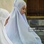 Muslim woman and young Asian Muslim girl praying in the mosque. of Ayutthaya Province, Thailand