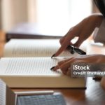 Close-up editor book with using tablet and stylus pen.