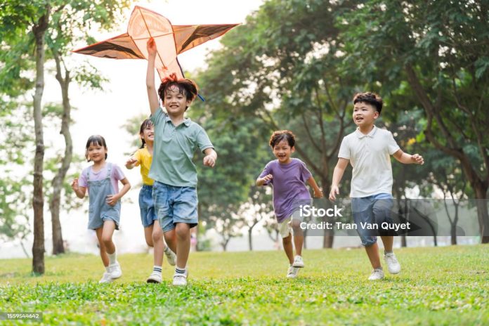 group image of cute asian children playing in the park